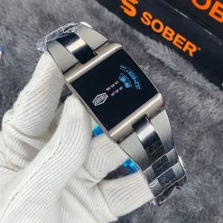 This is a HEROFORCE Big Tic Flame watch with a stainless steel strap and LED black light.