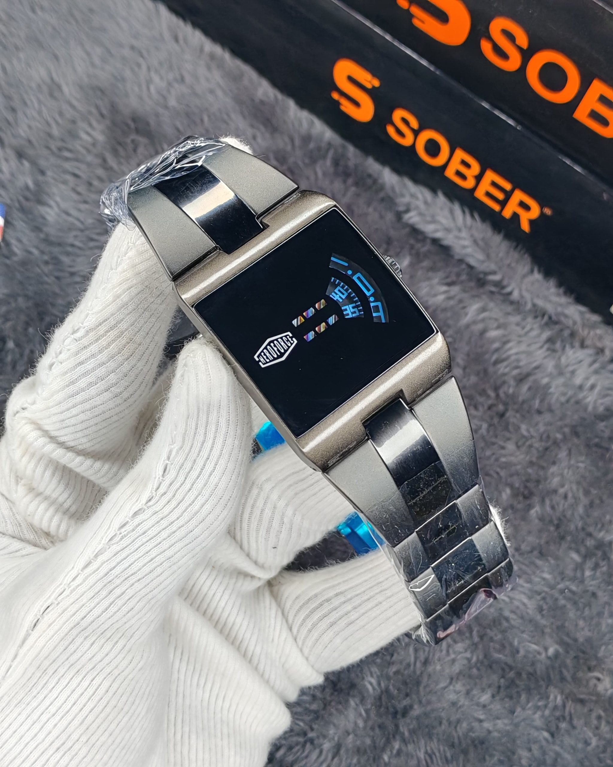 This is a HEROFORCE Big Tic Flame watch with a stainless steel strap and LED black light.